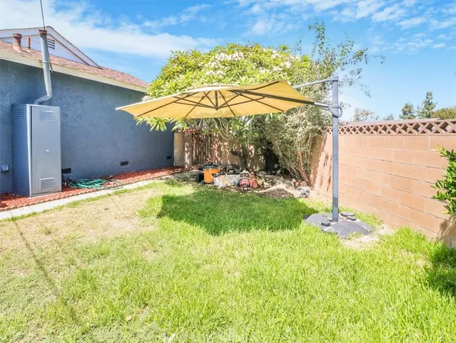 a view of a backyard with a patio