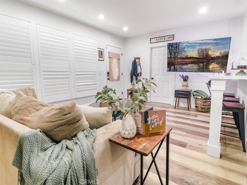 6502 Dos Rios Road Downey, CA 90240 - Photo 10 of 21 a living room with furniture and a flat screen tv