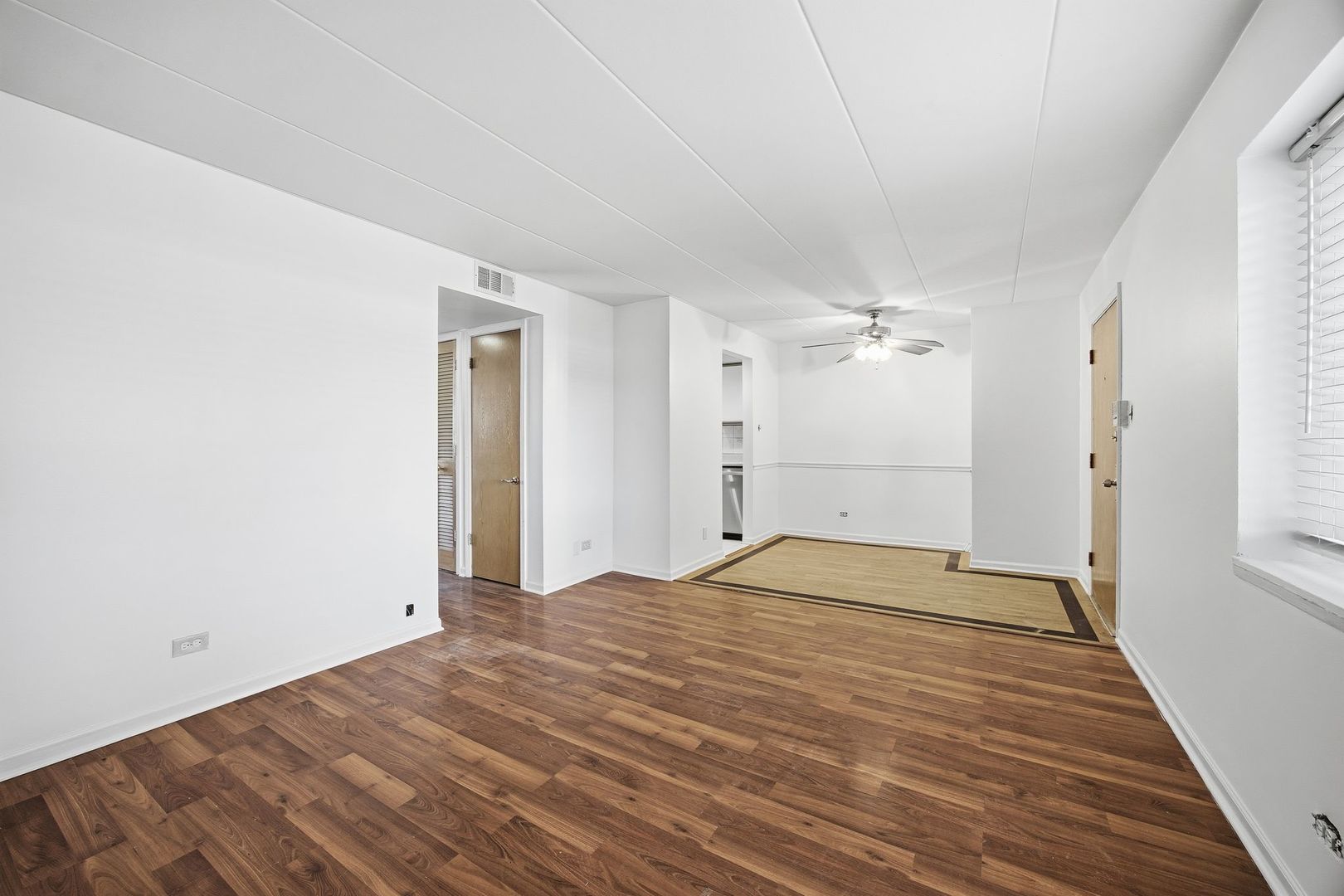 4618 River Road, Unit 1D Schiller Park, IL 60176 - Photo 4 of 12 a view of empty room with wooden floor