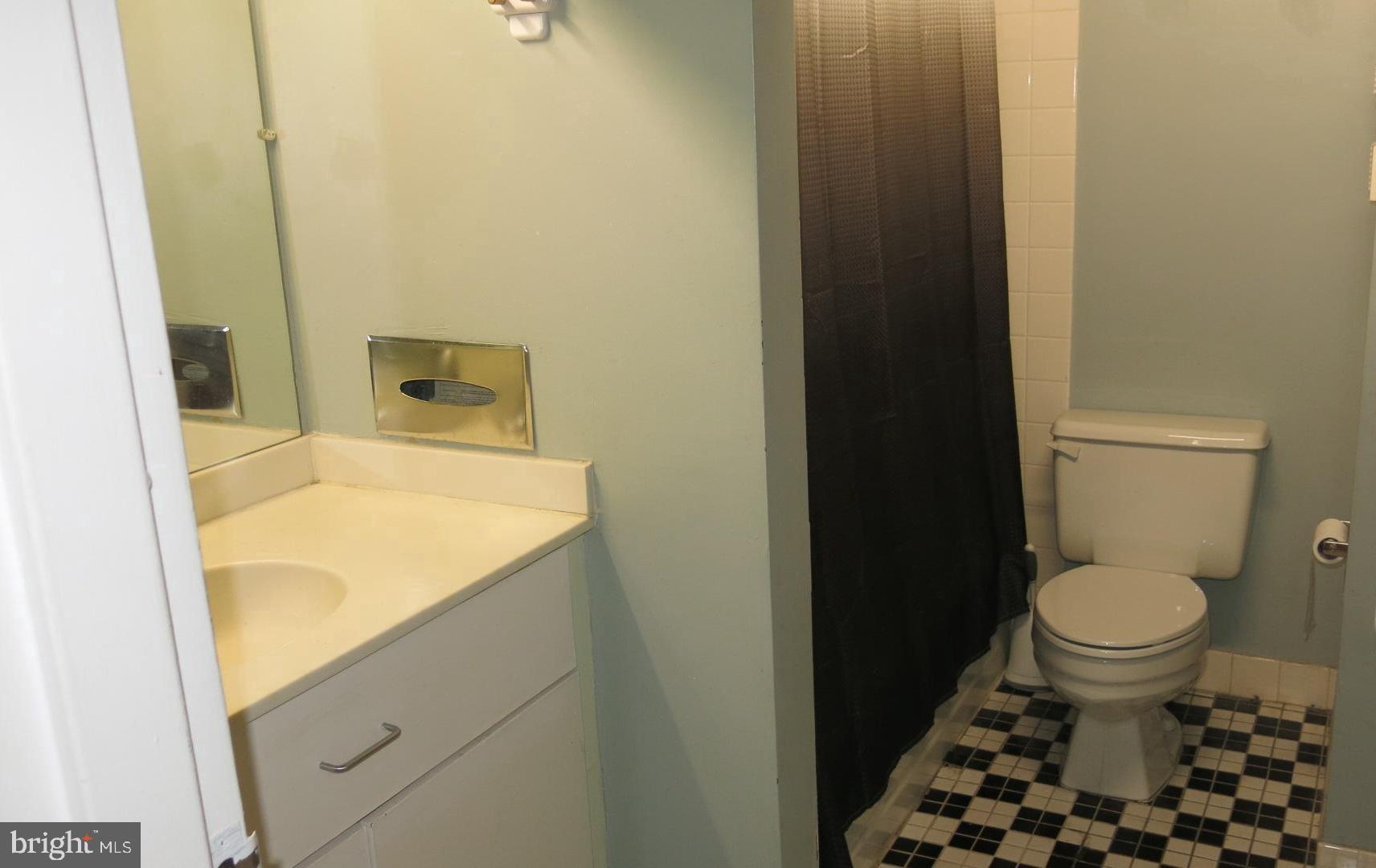 1010 Race Street, Unit 6K Philadelphia, PA 19107 - Photo 14 of 17 a bathroom with a sink and a toilet