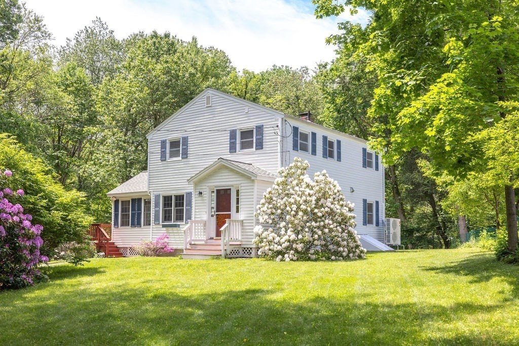 21 Vanderbelt Road Acton, MA 01720 - Photo 27 of 36 a front view of a house with a garden