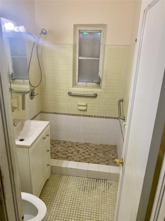 12225 Northwest 17th Avenue North Miami, FL 33167 - Photo 11 of 19 a bathroom with a granite countertop sink toilet and shower