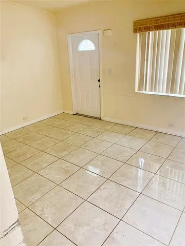 a view of an empty room and window