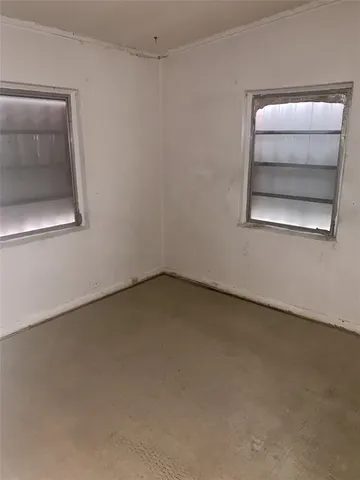 an empty room with a bench