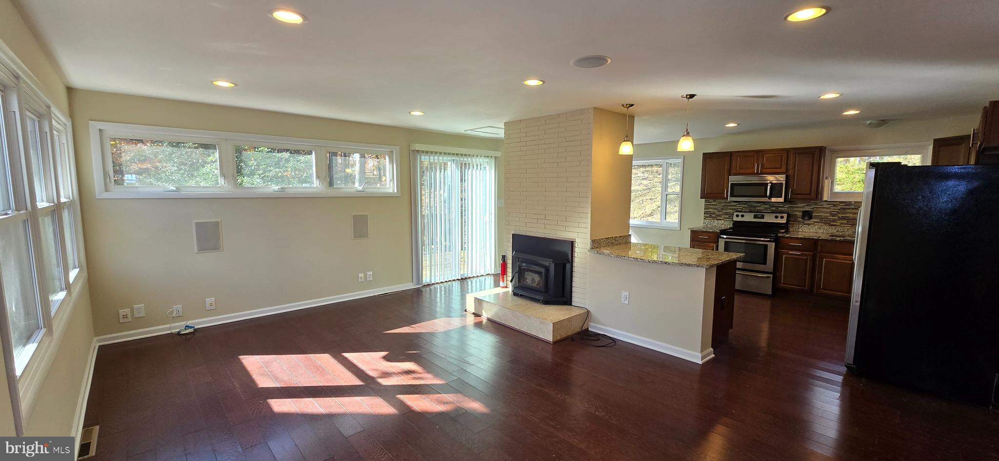 7613 Locust Lane Fort Washington, MD 20744 - Photo 15 of 49 a view of a kitchen with refrigerator and wooden floor