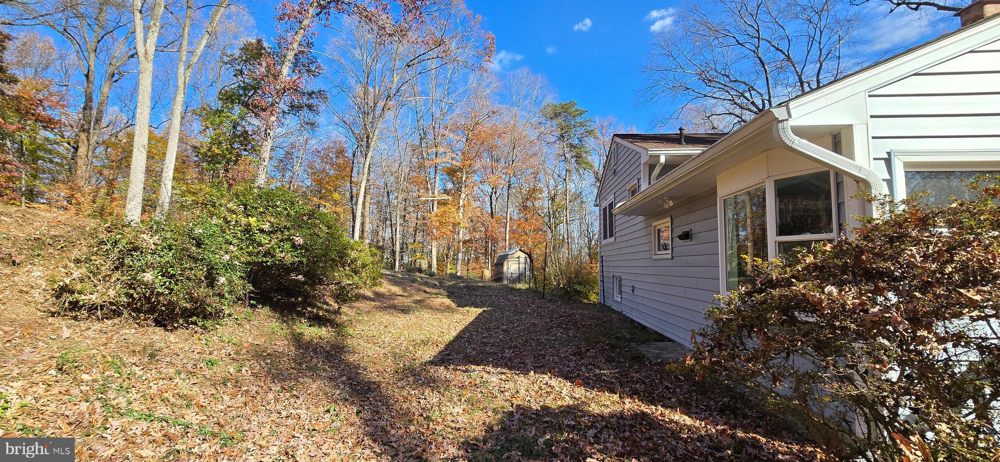 7613 Locust Lane Fort Washington, MD 20744 - Photo 6 of 49 a front view of a house with a yard
