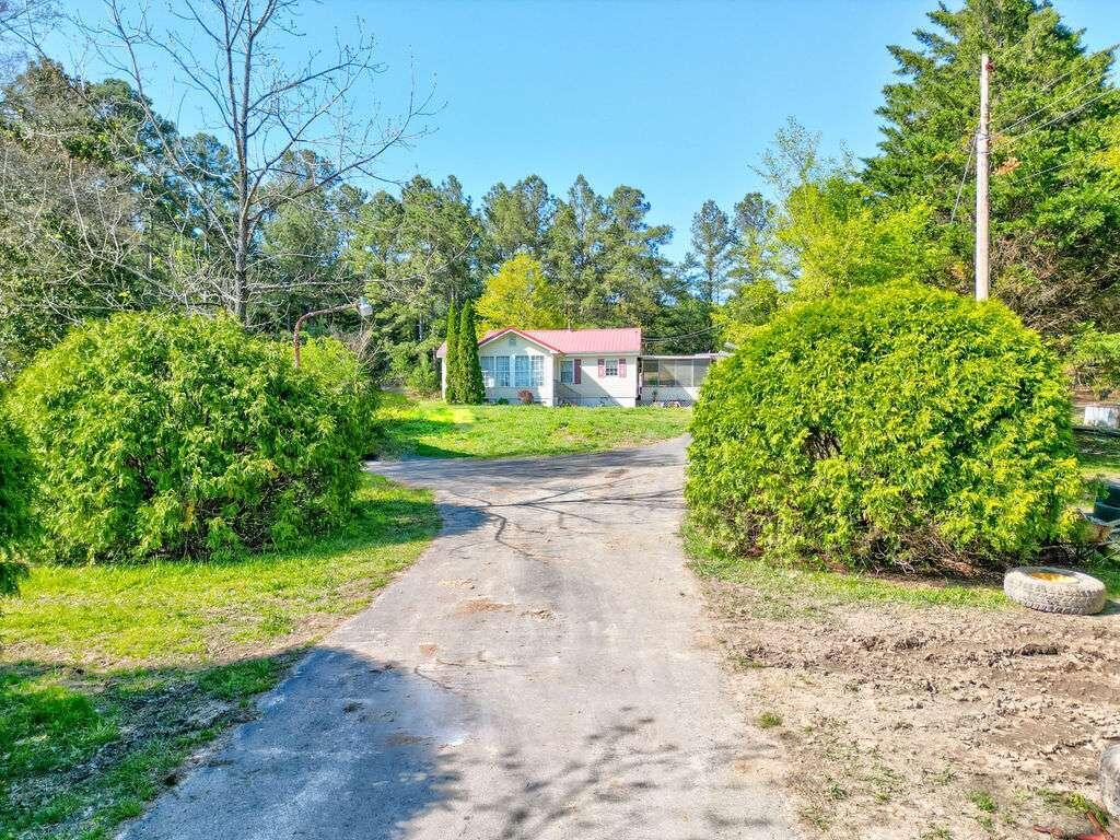 377 Wray Road Buchanan, GA 30113 - Photo 1 of 1 front view of a house with a yard