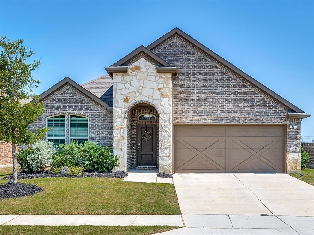 a front view of a house with garage
