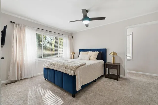 a bedroom with a bed and window