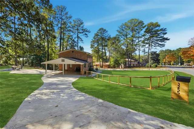 a view of a park with large trees