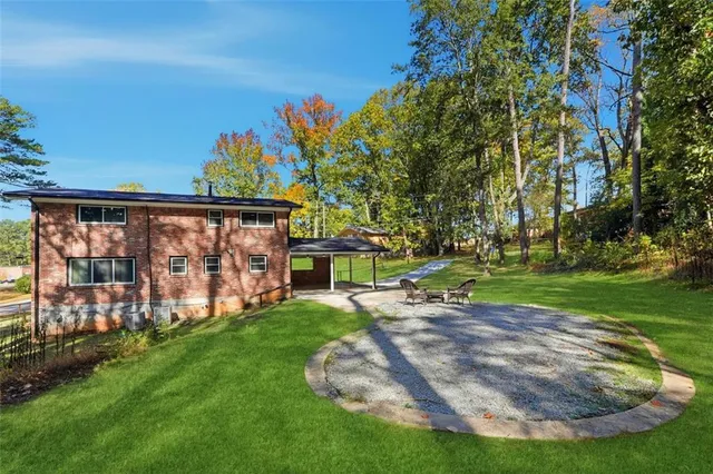 a view of a backyard with wooden fence