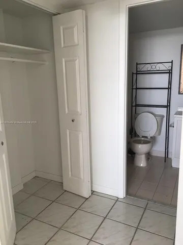 a bathroom with a toilet and a sink