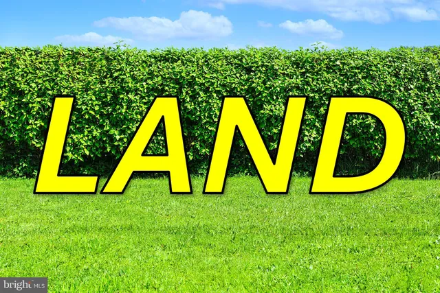 a view of swimming pool with a house