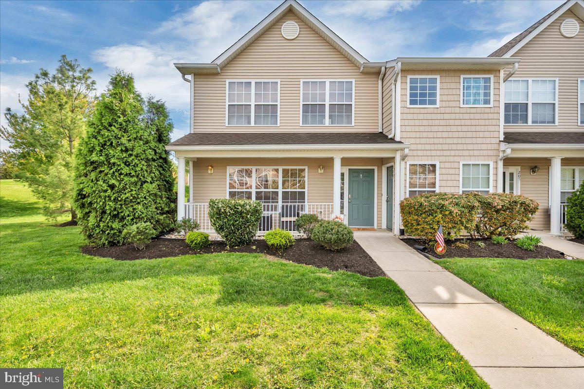 207 Redbud Lane, Unit 207 Mantua, NJ 08051 - Photo 1 of 22 a front view of a house with a yard
