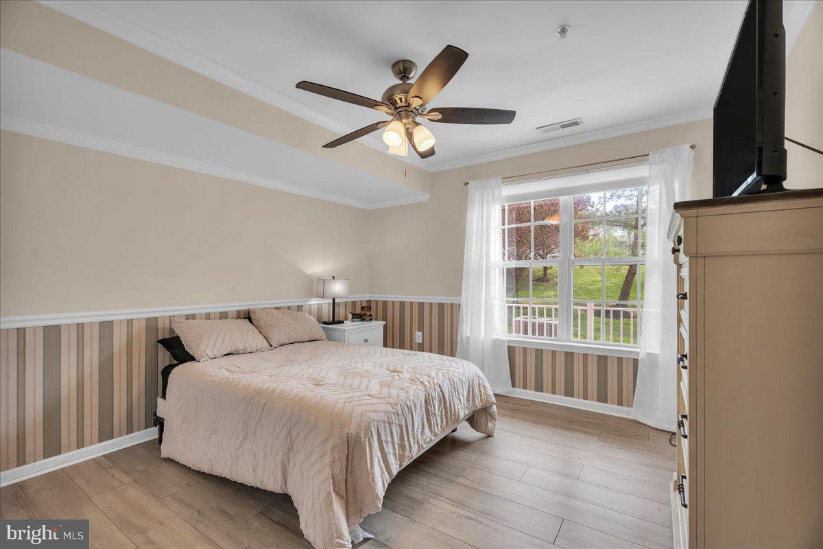 207 Redbud Lane, Unit 207 Mantua, NJ 08051 - Photo 15 of 22 a bedroom with a large bed and a window