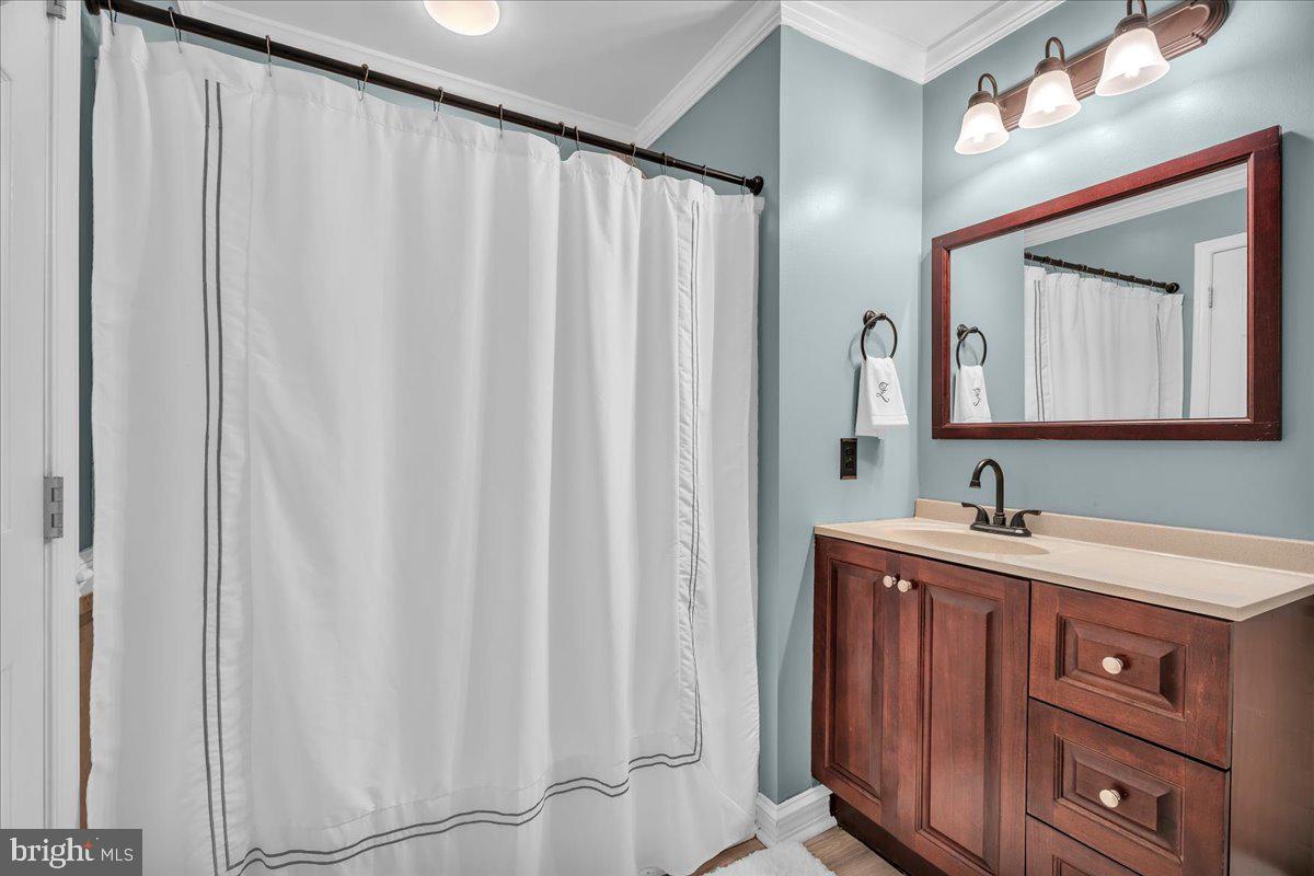 207 Redbud Lane, Unit 207 Mantua, NJ 08051 - Photo 19 of 22 a bathroom with a sink and a mirror