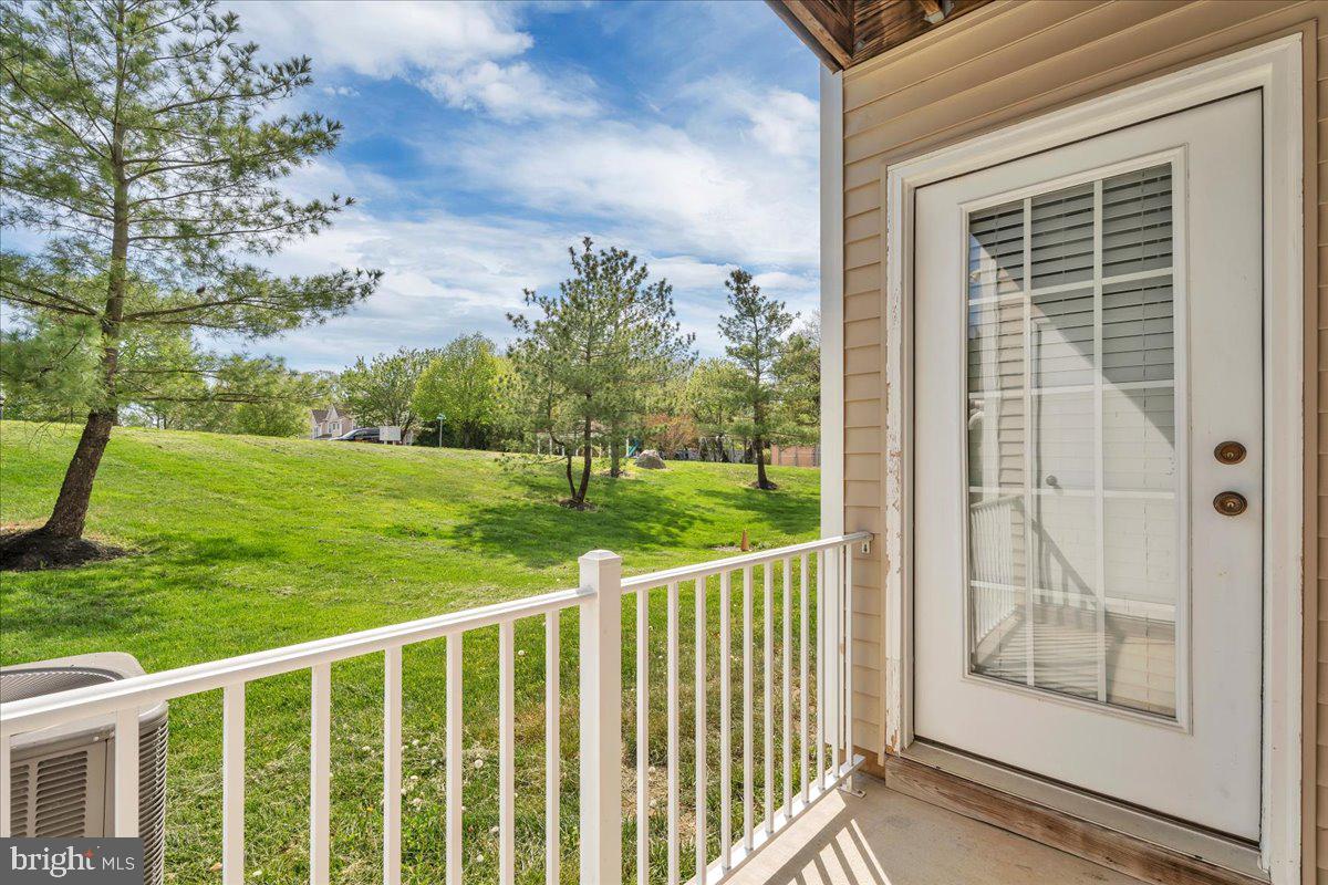 207 Redbud Lane, Unit 207 Mantua, NJ 08051 - Photo 20 of 22 a view of a porch with a yard