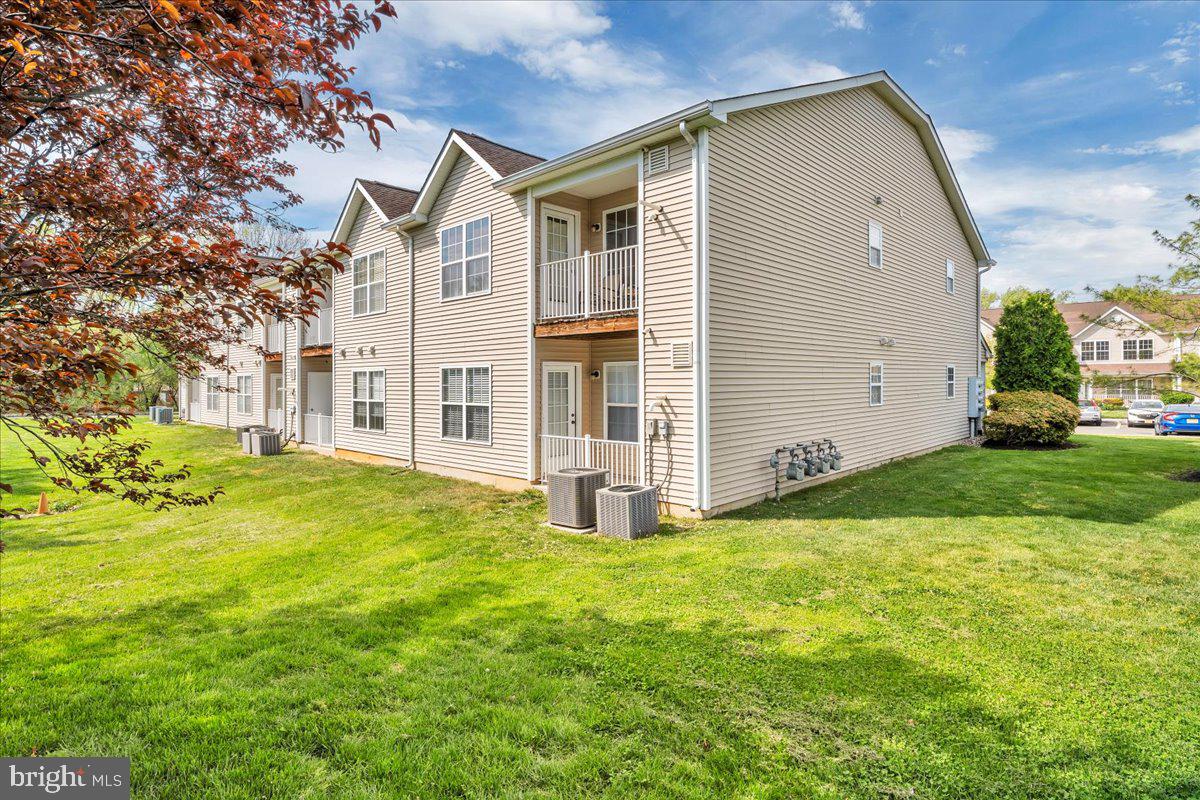 207 Redbud Lane, Unit 207 Mantua, NJ 08051 - Photo 22 of 22 a view of a house with backyard and garden