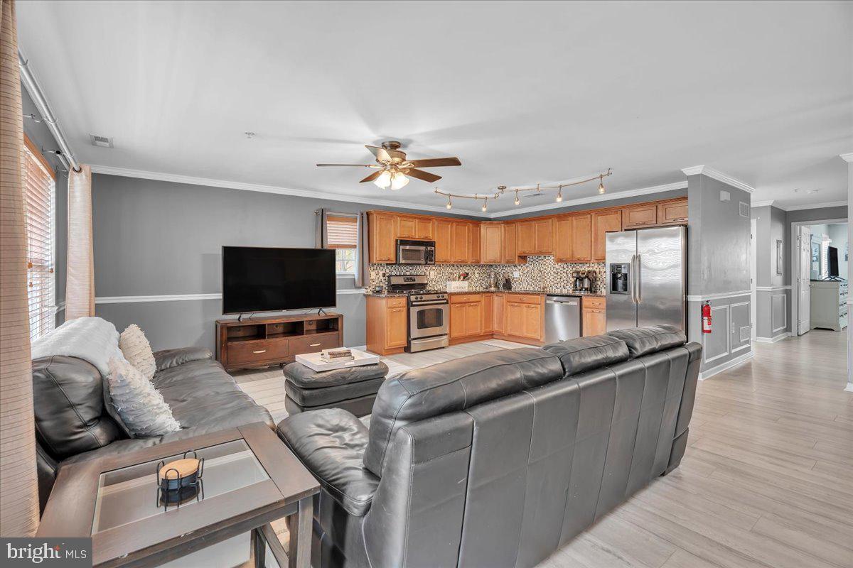 207 Redbud Lane, Unit 207 Mantua, NJ 08051 - Photo 4 of 22 a living room with furniture and a flat screen tv