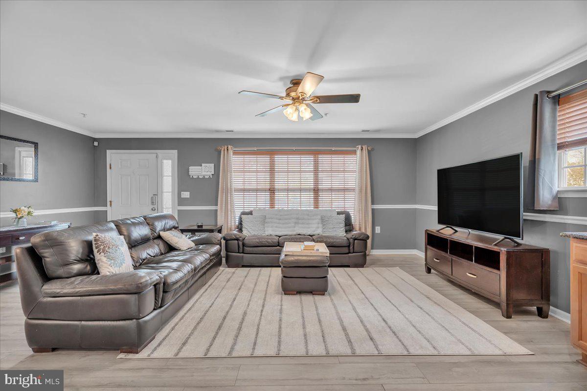 207 Redbud Lane, Unit 207 Mantua, NJ 08051 - Photo 6 of 22 a living room with furniture and a flat screen tv