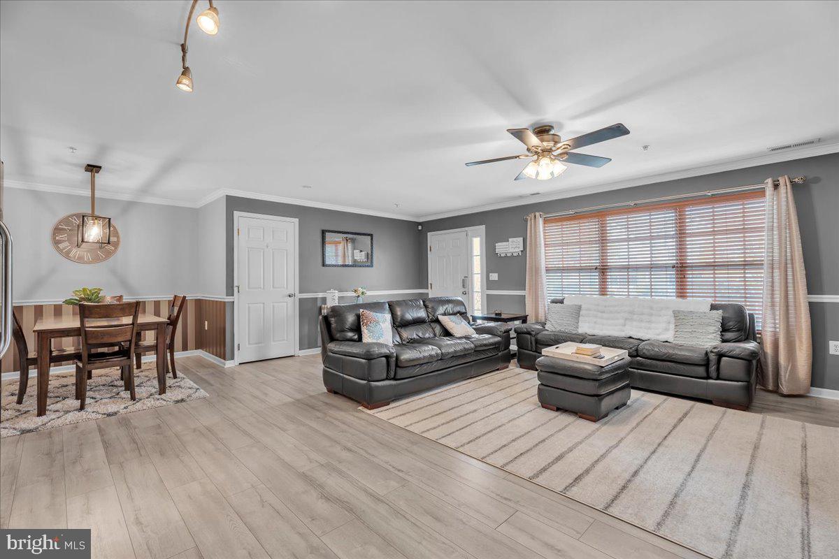 207 Redbud Lane, Unit 207 Mantua, NJ 08051 - Photo 8 of 22 a living room with furniture and a large window