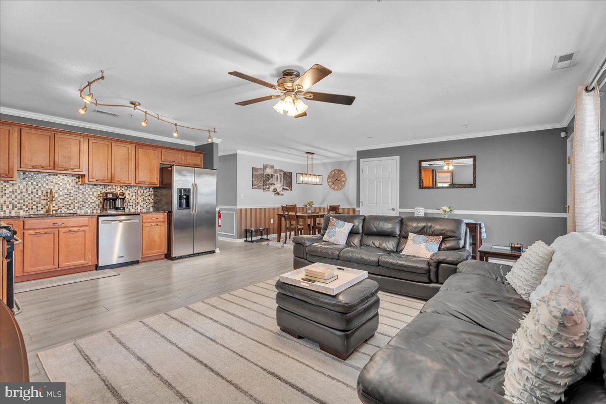 207 Redbud Lane, Unit 207 Mantua, NJ 08051 - Photo 9 of 22 a living room with furniture and kitchen view