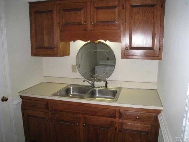 2408 Chello Court Raleigh, NC 27612 - Photo 7 of 10 a sink sitting inside of a kitchen