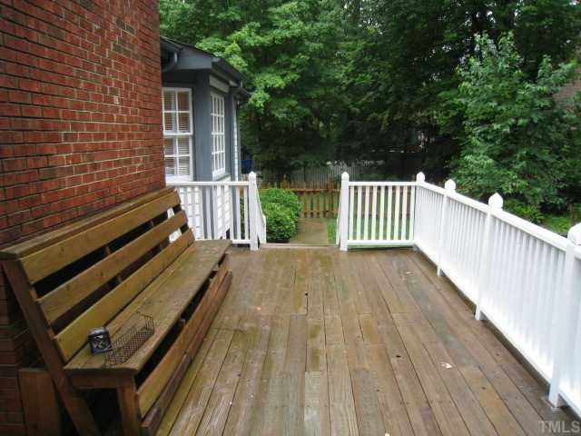 2408 Chello Court Raleigh, NC 27612 - Photo 8 of 10 a view of backyard with wooden floor and fence