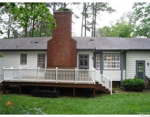 2408 Chello Court Raleigh, NC 27612 - Photo 10 of 10 a front view of a house with a garden and deck