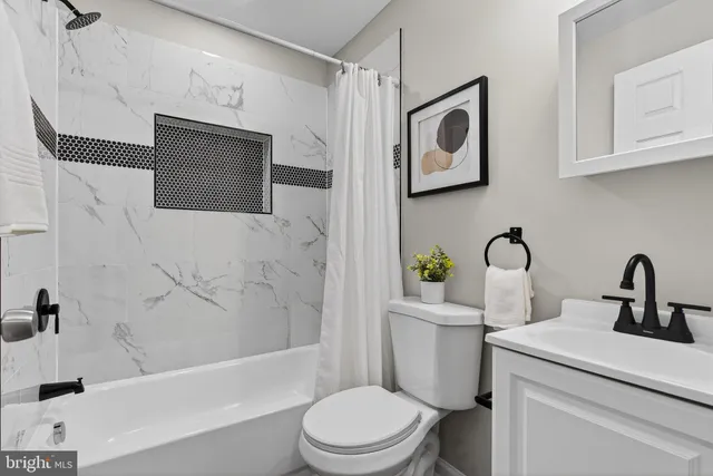 a bathroom with a toilet sink and bathtub
