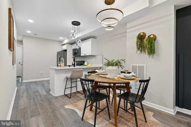 a view of a dining room with furniture and wooden floor