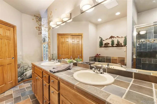 a bathroom with a double vanity sink mirror and double