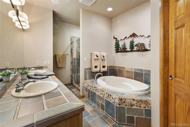 a bathroom with a sink a mirror and a toilet