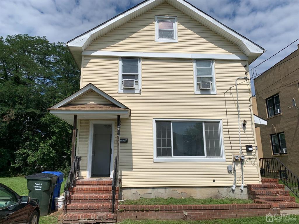 13 Melbourne Court, Unit 1 Woodbridge, NJ 07095 - Photo 1 of 11 a front view of a house