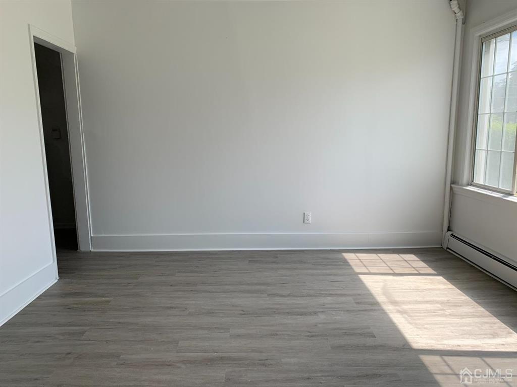 13 Melbourne Court, Unit 1 Woodbridge, NJ 07095 - Photo 4 of 11 a view of an empty room and window