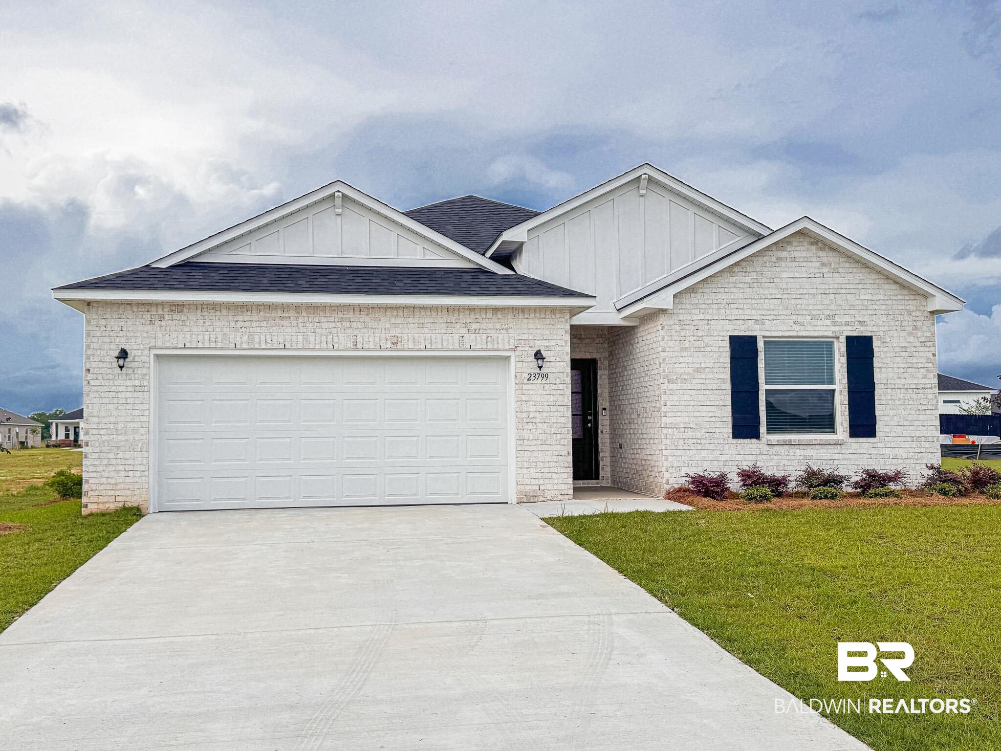 23799 Lafite Circle Daphne, AL 36526 - Photo 1 of 6 Contemporary single-story residence featuring white brick and vertical siding accents