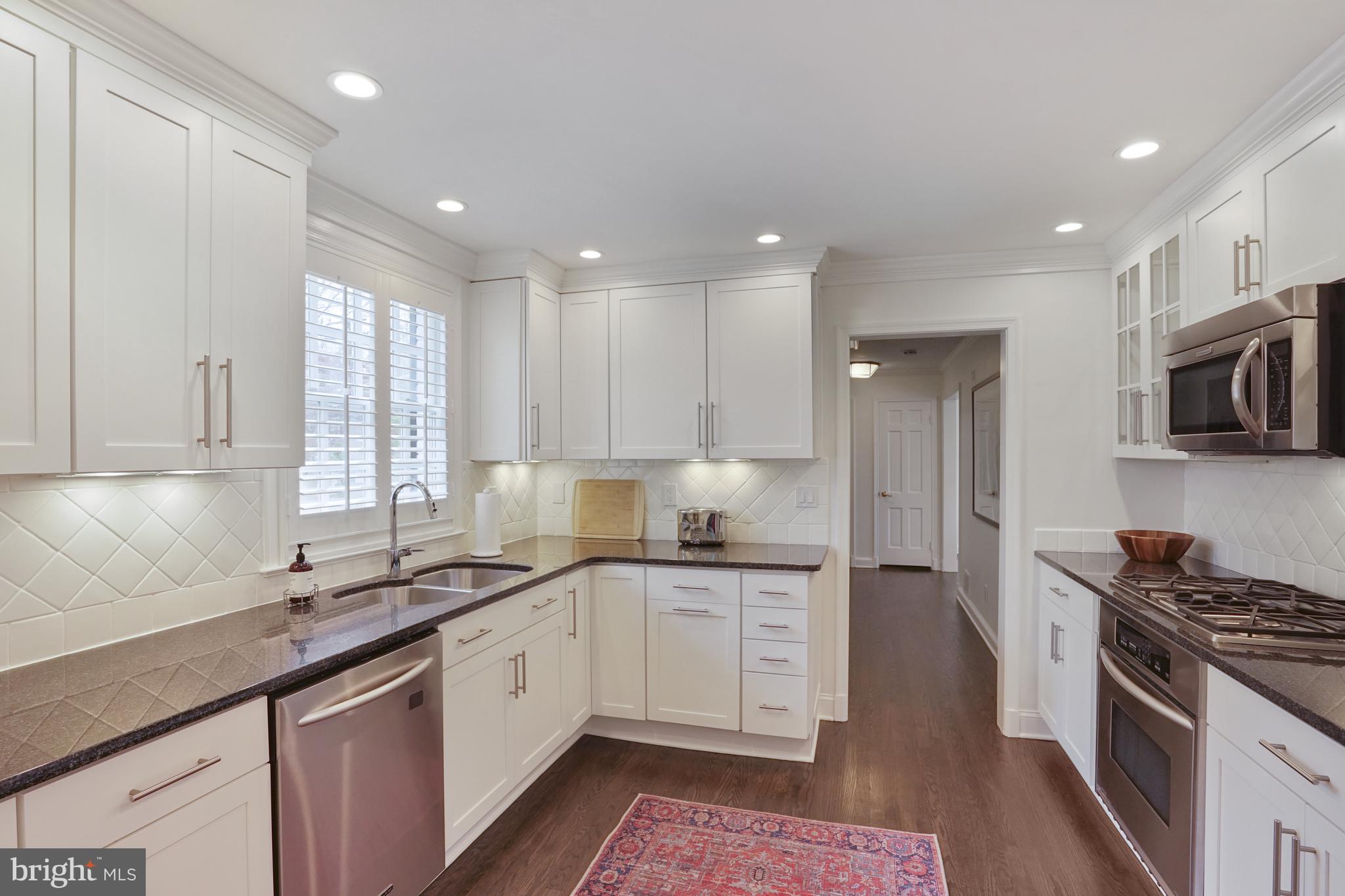 4603 Tournay Road Bethesda, MD 20816 - Photo 9 of 26 Kitchen with granite countertops and stainless app