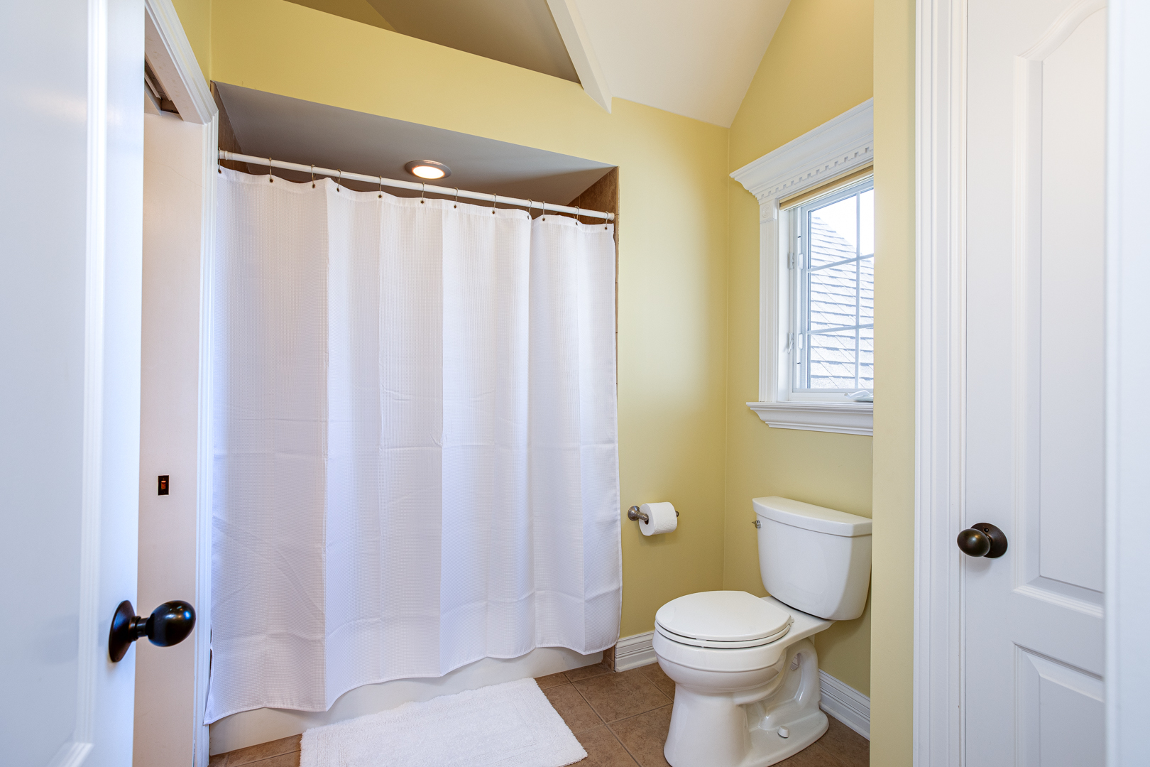 3976 Bluejay Lane Naperville, IL 60564 - Photo 20 of 34 a white toilet sitting next to a bathroom sink