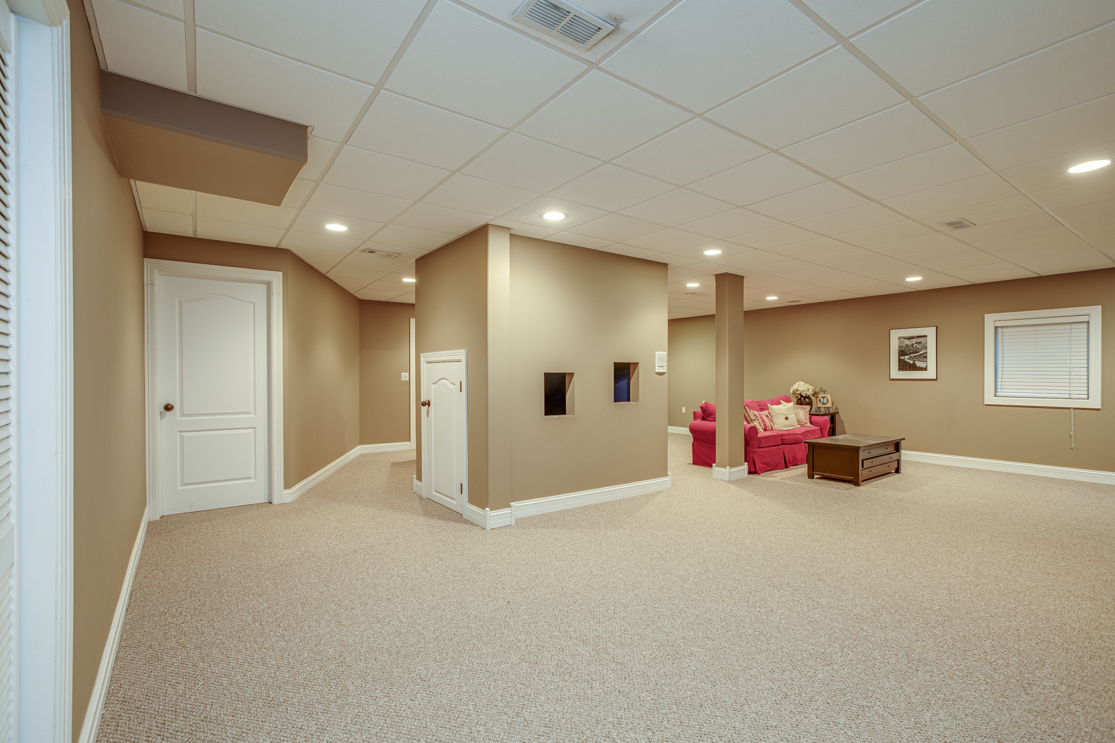 3976 Bluejay Lane Naperville, IL 60564 - Photo 27 of 34 a view of a room with gym equipment and a chandelier