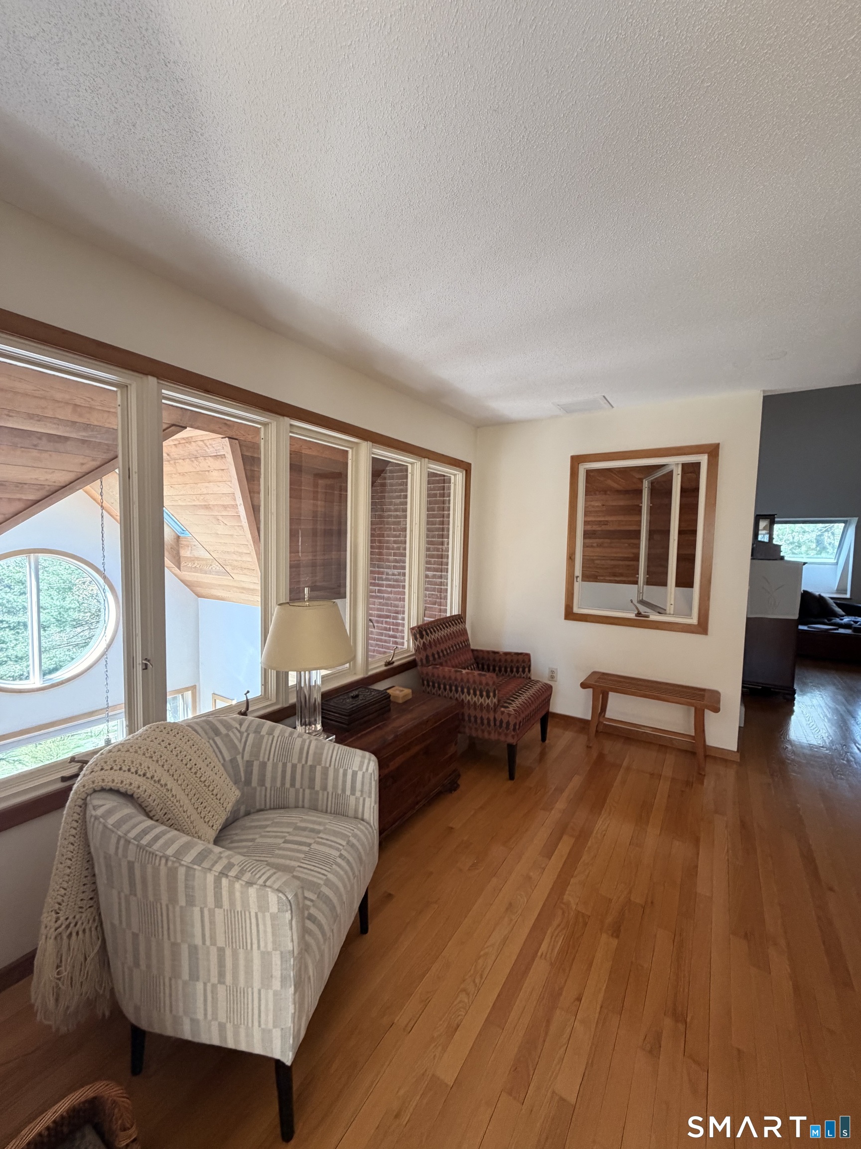 86 Washburn Road Canton, CT 06019 - Photo 30 of 40 a living room with furniture and a large window