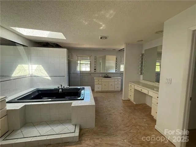 a bathroom with a glass door shower