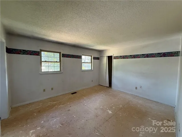 a bathroom with a toilet and a tub