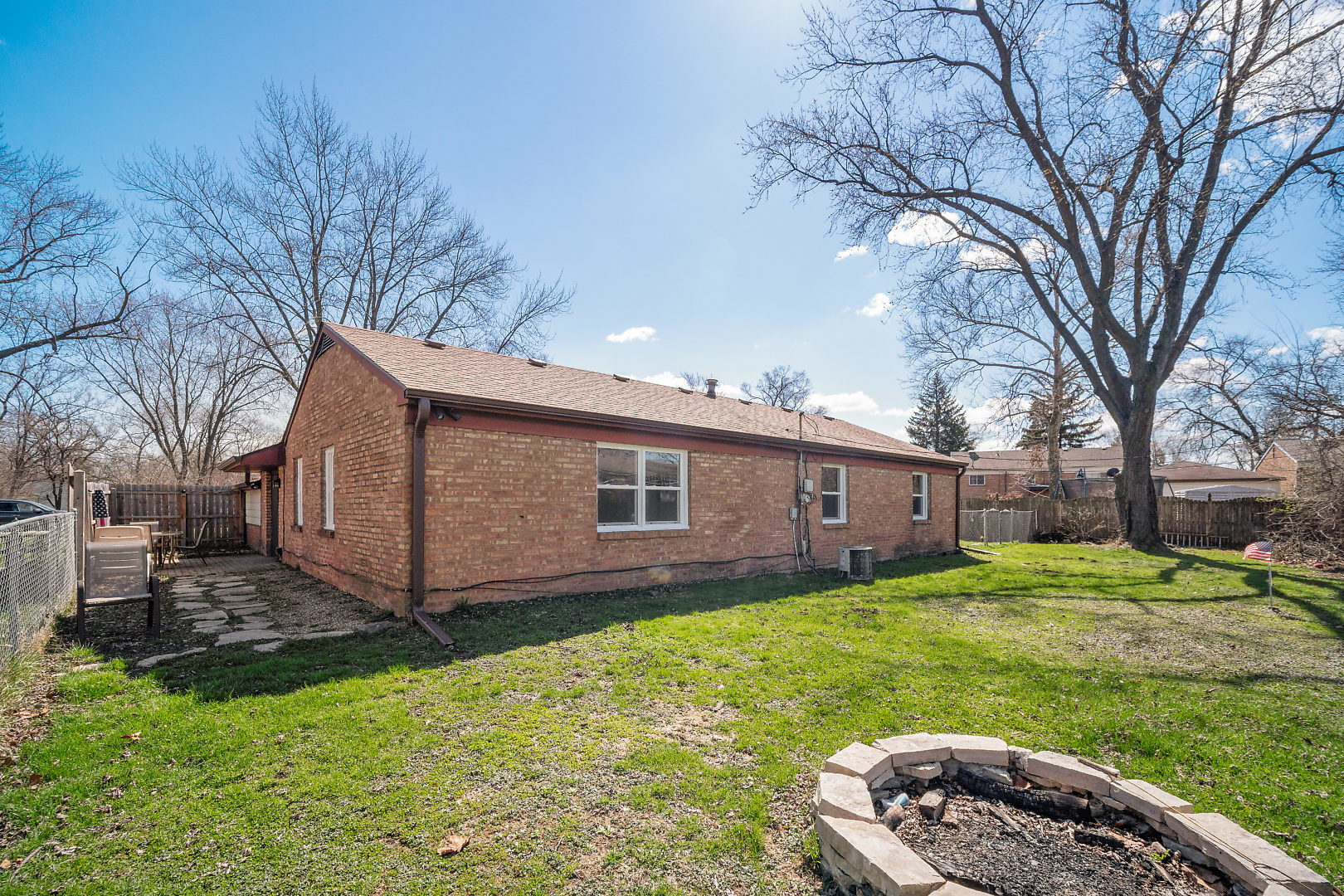 149 Mellbrook Road Bolingbrook, IL 60440 - Photo 17 of 17 a backyard of a house with yard and outdoor seating