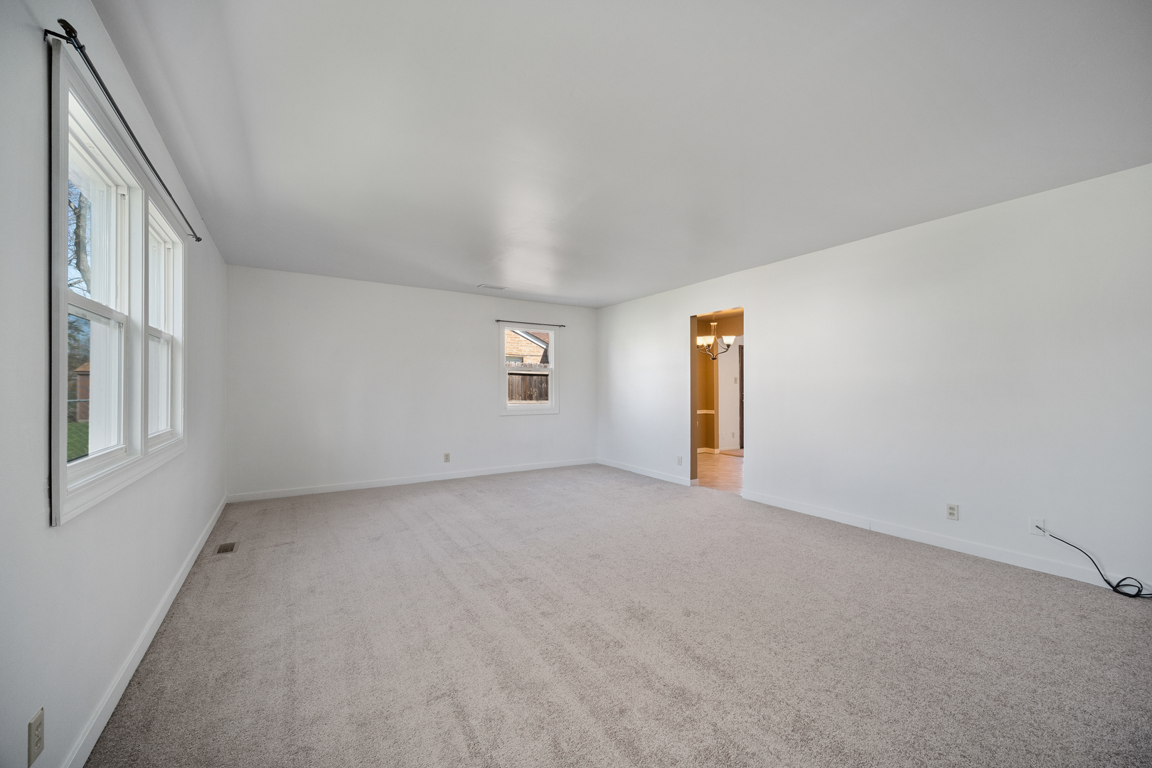 149 Mellbrook Road Bolingbrook, IL 60440 - Photo 8 of 17 an empty room with windows