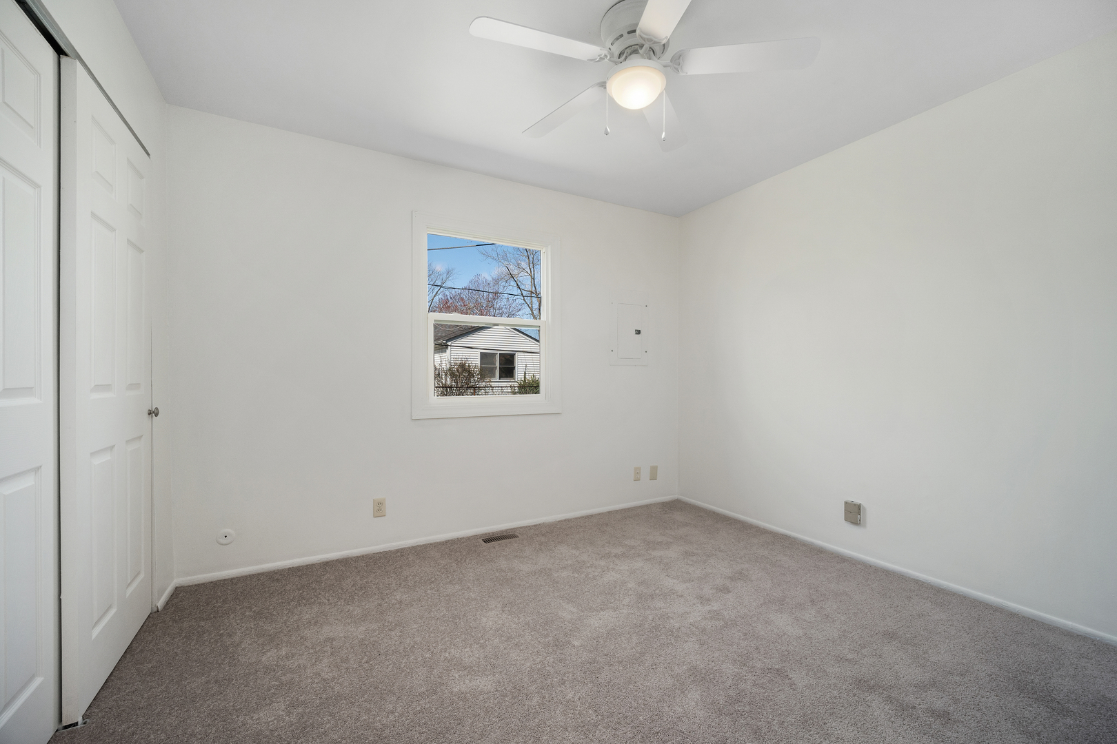 149 Mellbrook Road Bolingbrook, IL 60440 - Photo 10 of 17 an empty room with a fan & a window