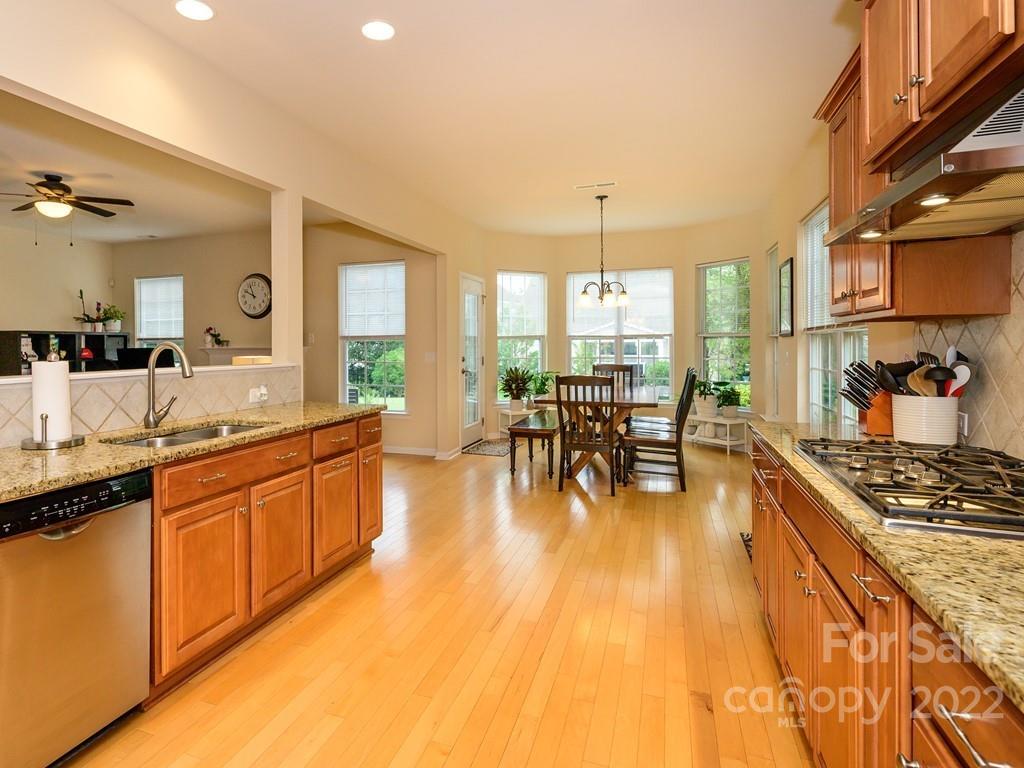 8421 Cotton Press Road Charlotte, NC 28277 - Photo 14 of 40 a large kitchen with lots of counter space and a sink