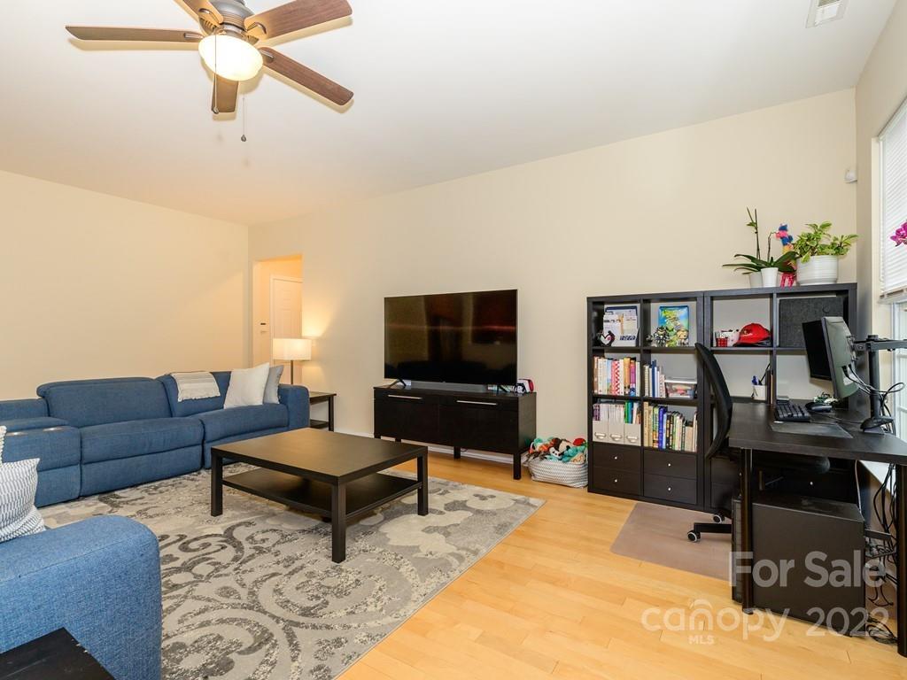 8421 Cotton Press Road Charlotte, NC 28277 - Photo 20 of 40 a living room with furniture and a flat screen tv