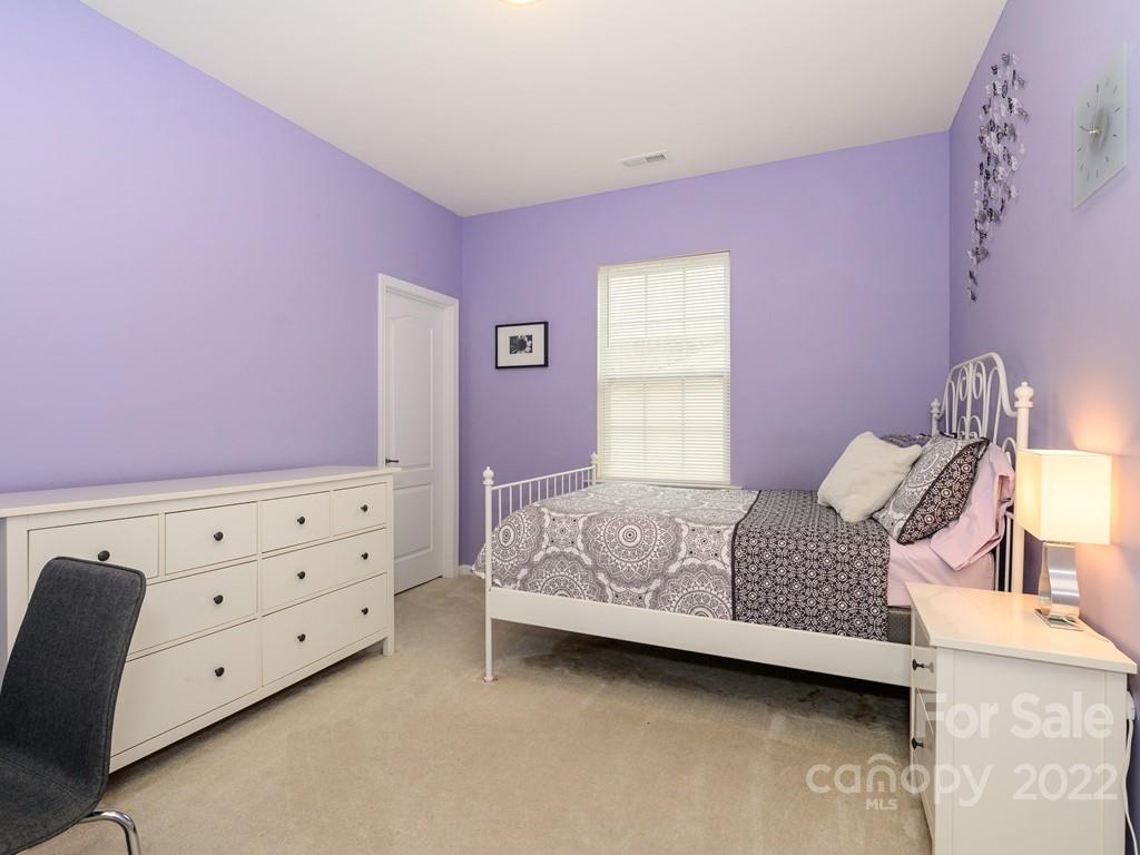 8421 Cotton Press Road Charlotte, NC 28277 - Photo 29 of 40 a bedroom with a bed and a dresser