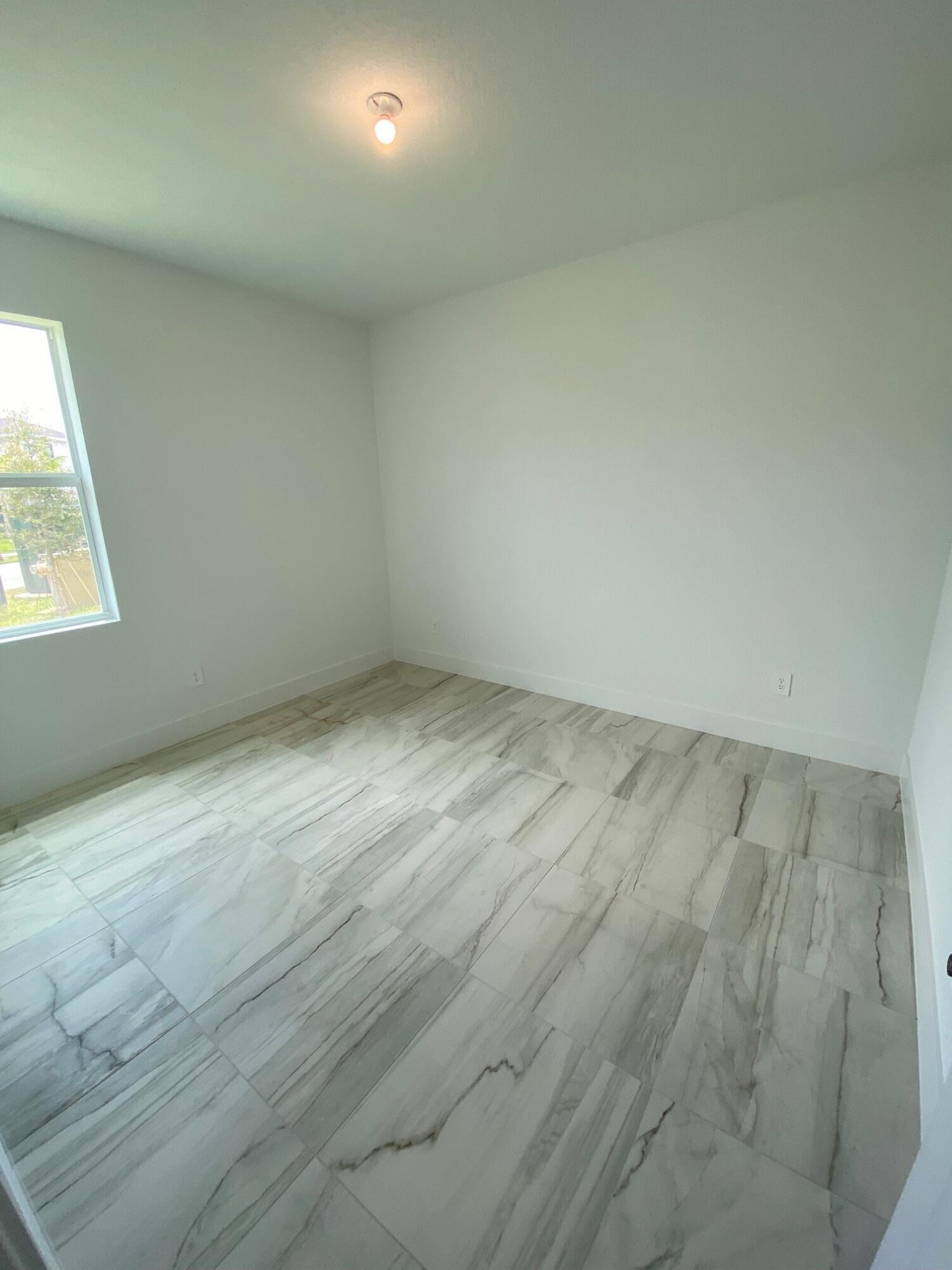 7100 Southeast Park Trace Stuart, FL 34997 - Photo 12 of 15 PPT 29 3rd bedroom