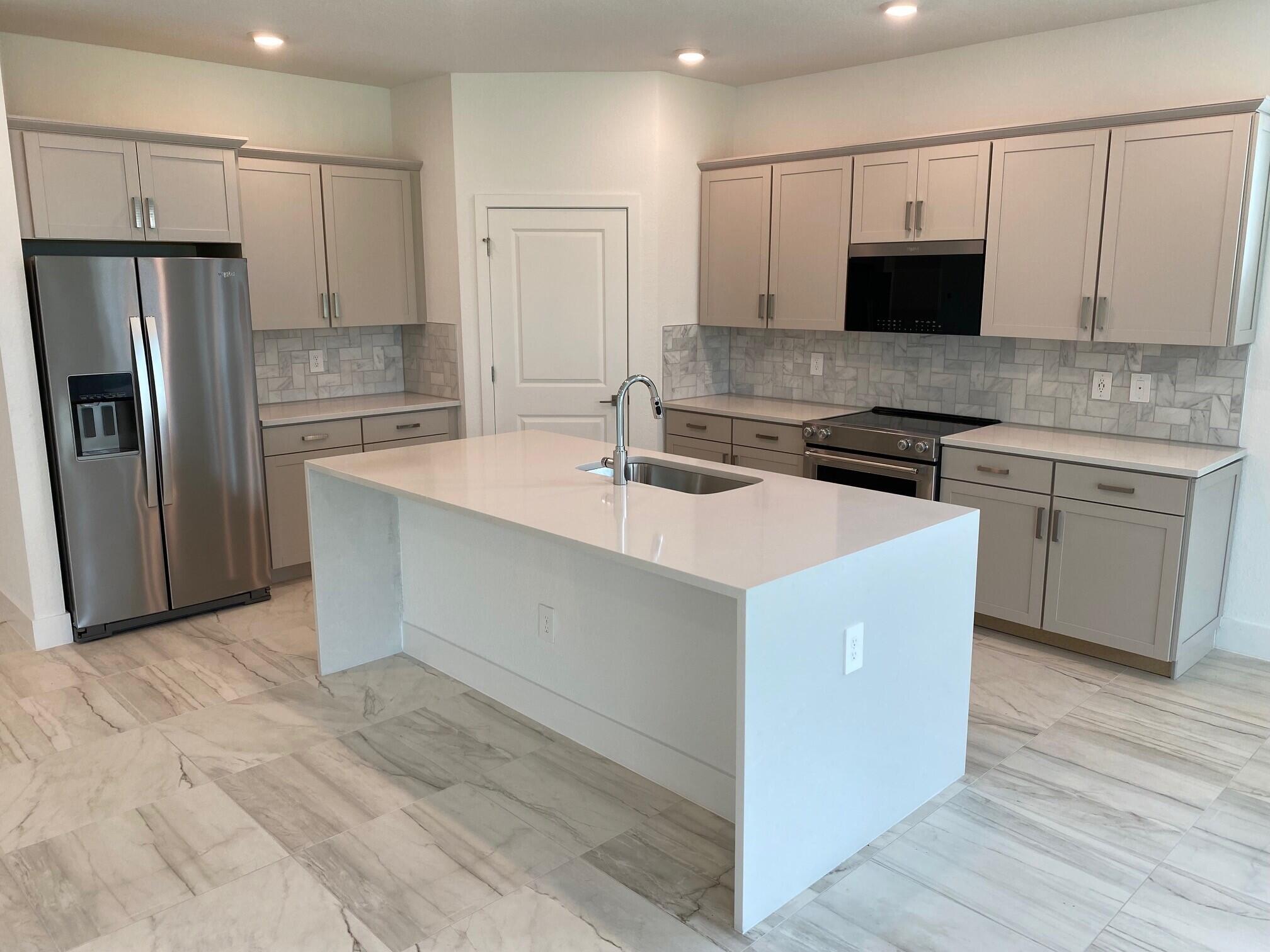 7100 Southeast Park Trace Stuart, FL 34997 - Photo 5 of 15 PPT 29 Kitchen